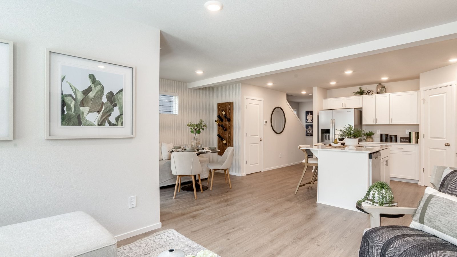 Great room with laminate flooring and an electric fireplace