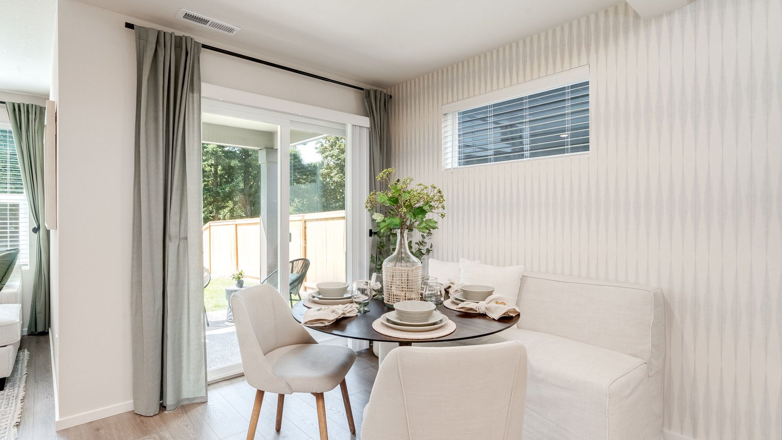 Dining area with a sliding glass door to a fenced backyard