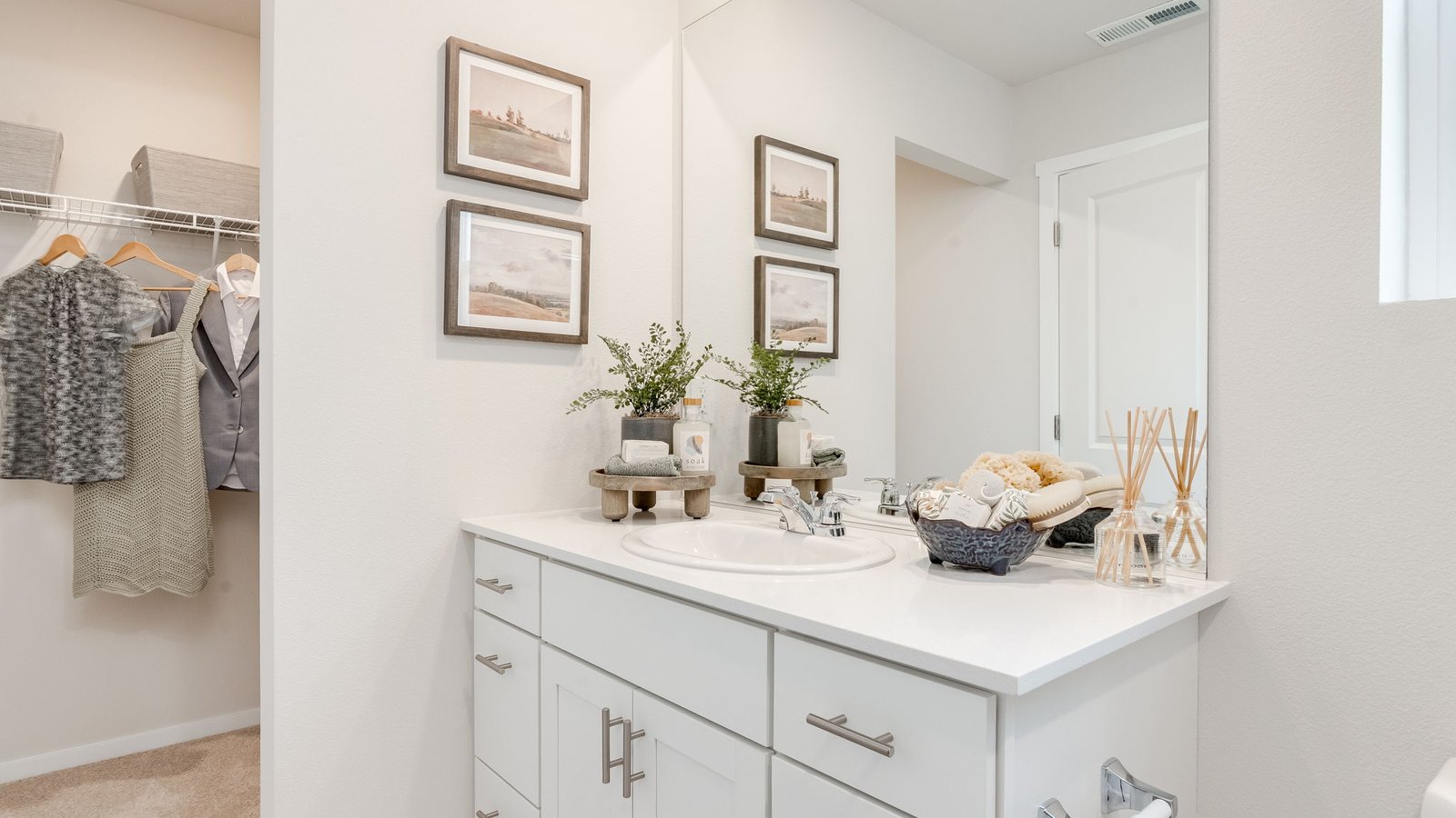 Primary bathroom with quartz counters and a walk-in shower