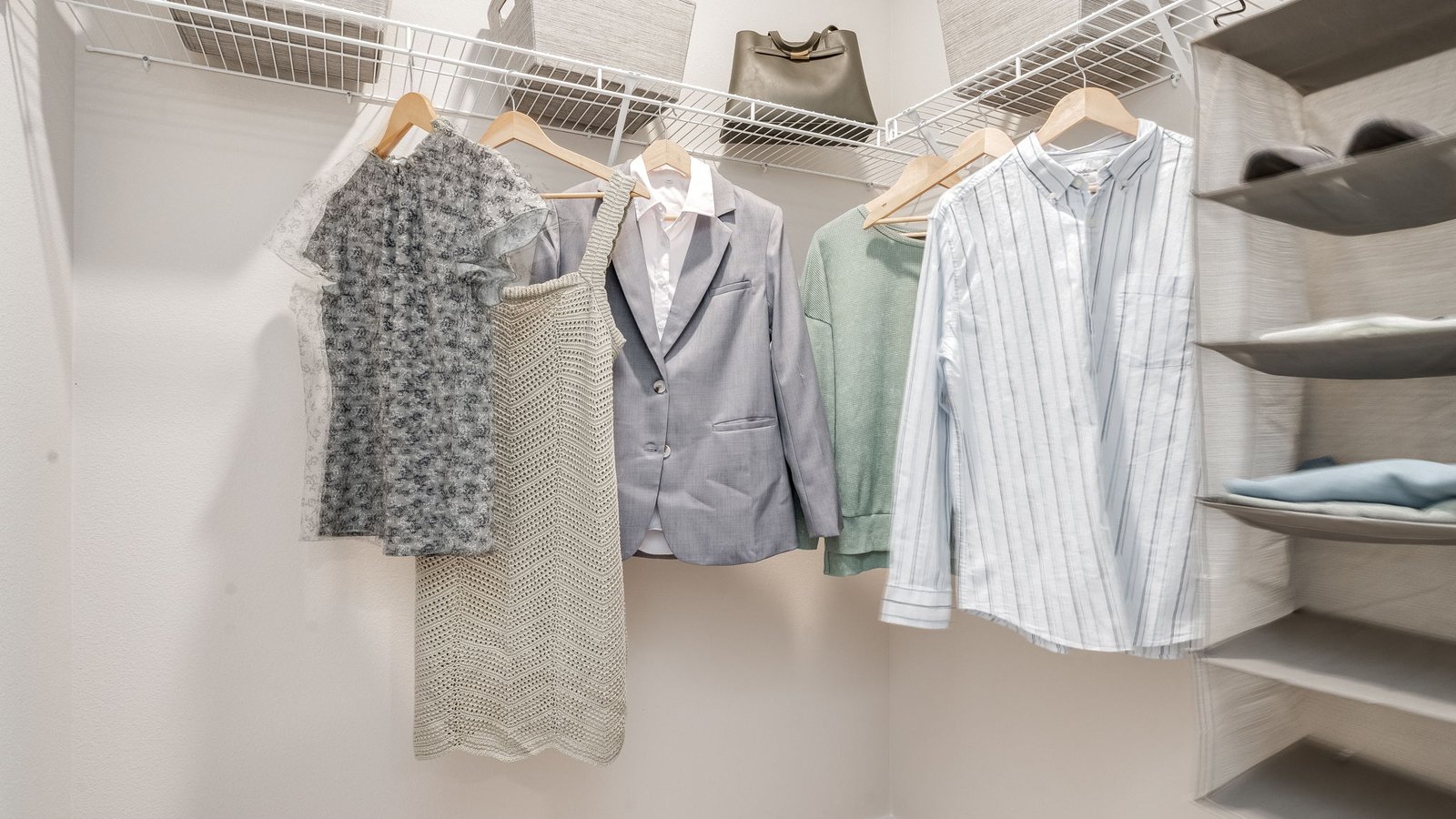 Primary bedroom walk-in closet with wire shelves