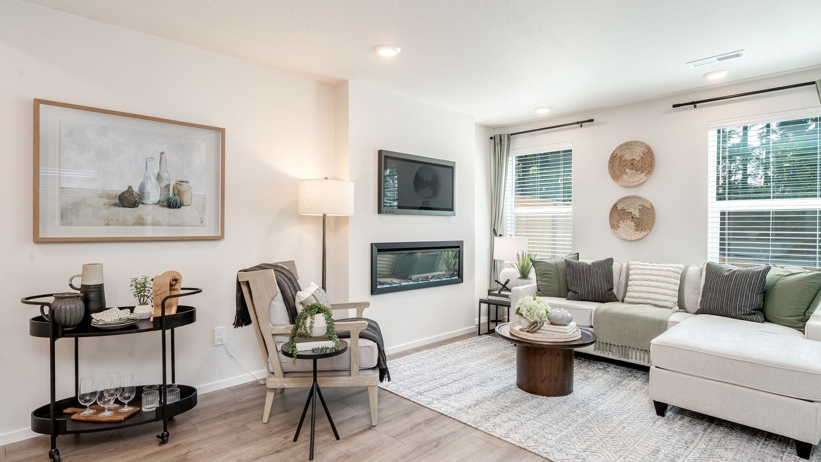 Great room with laminate flooring and an electric fireplace