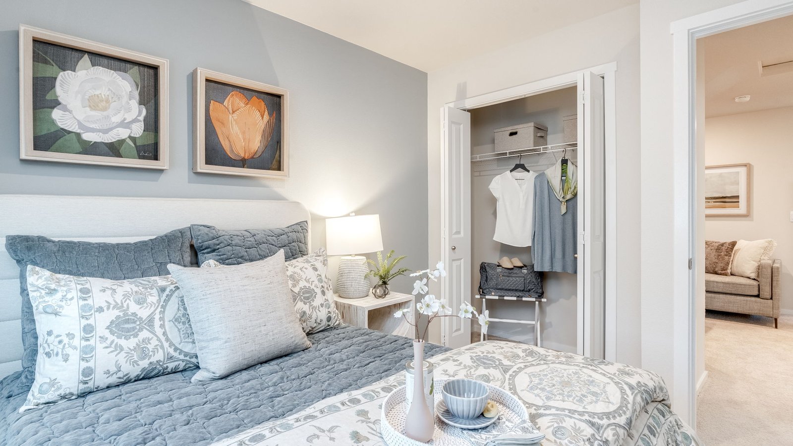 Bedroom with wall-to-wall carpet and a closet