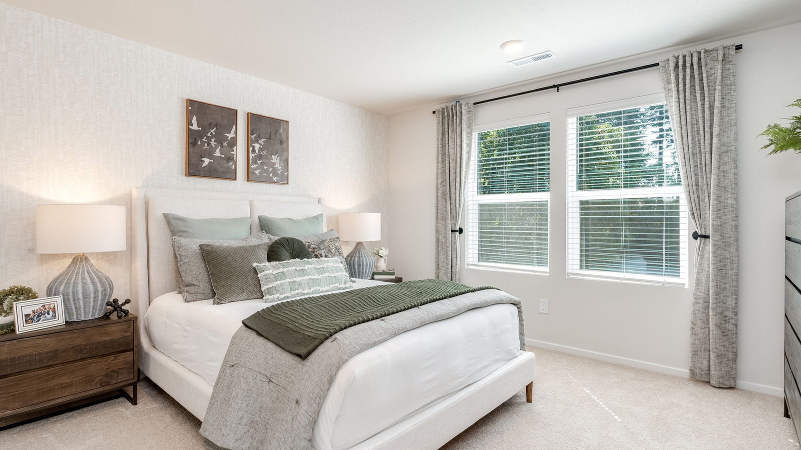 Primary bedroom with wall-to-wall carpet, a walk-in closet and an attached bathroom