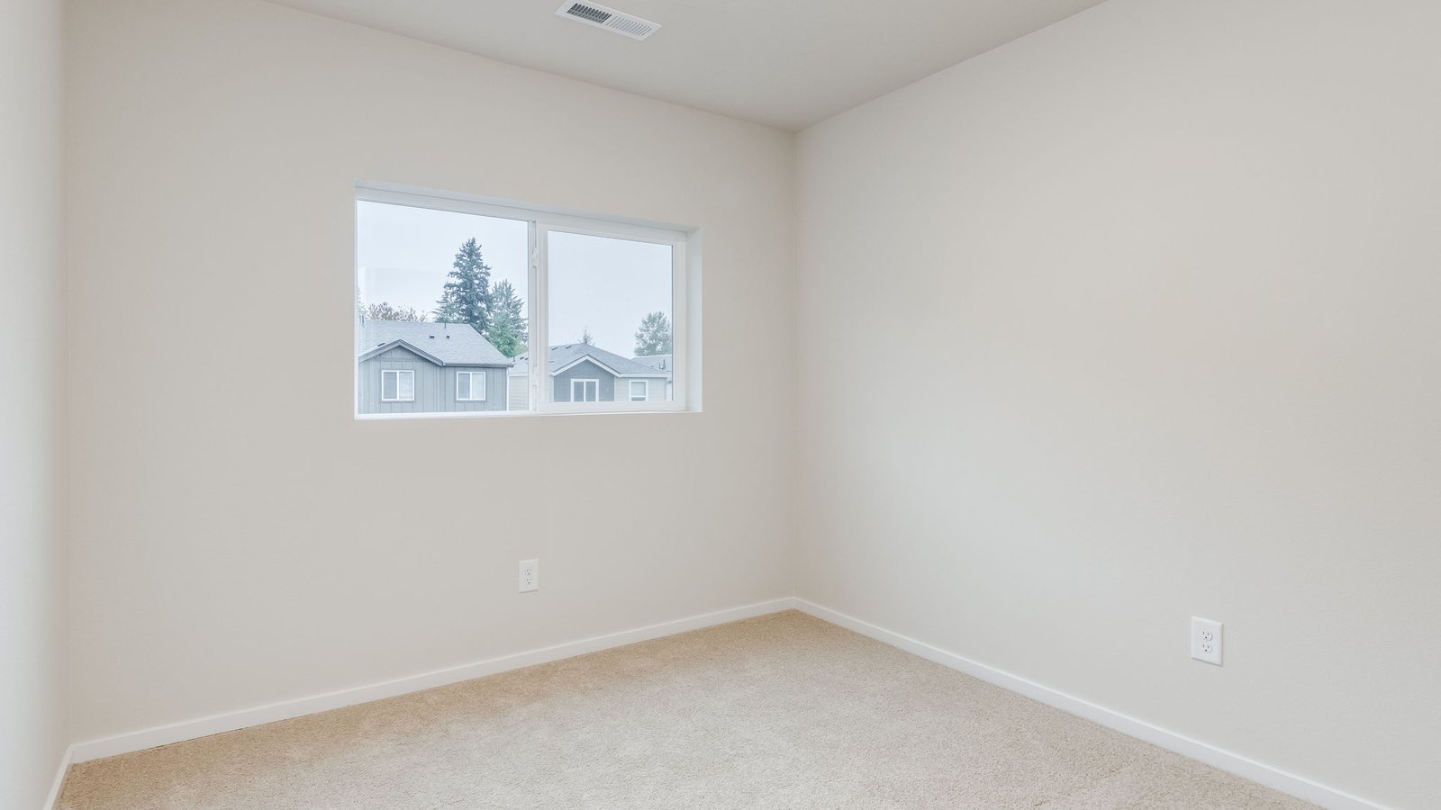 Bedroom with wall-to-wall carpet and a closet
