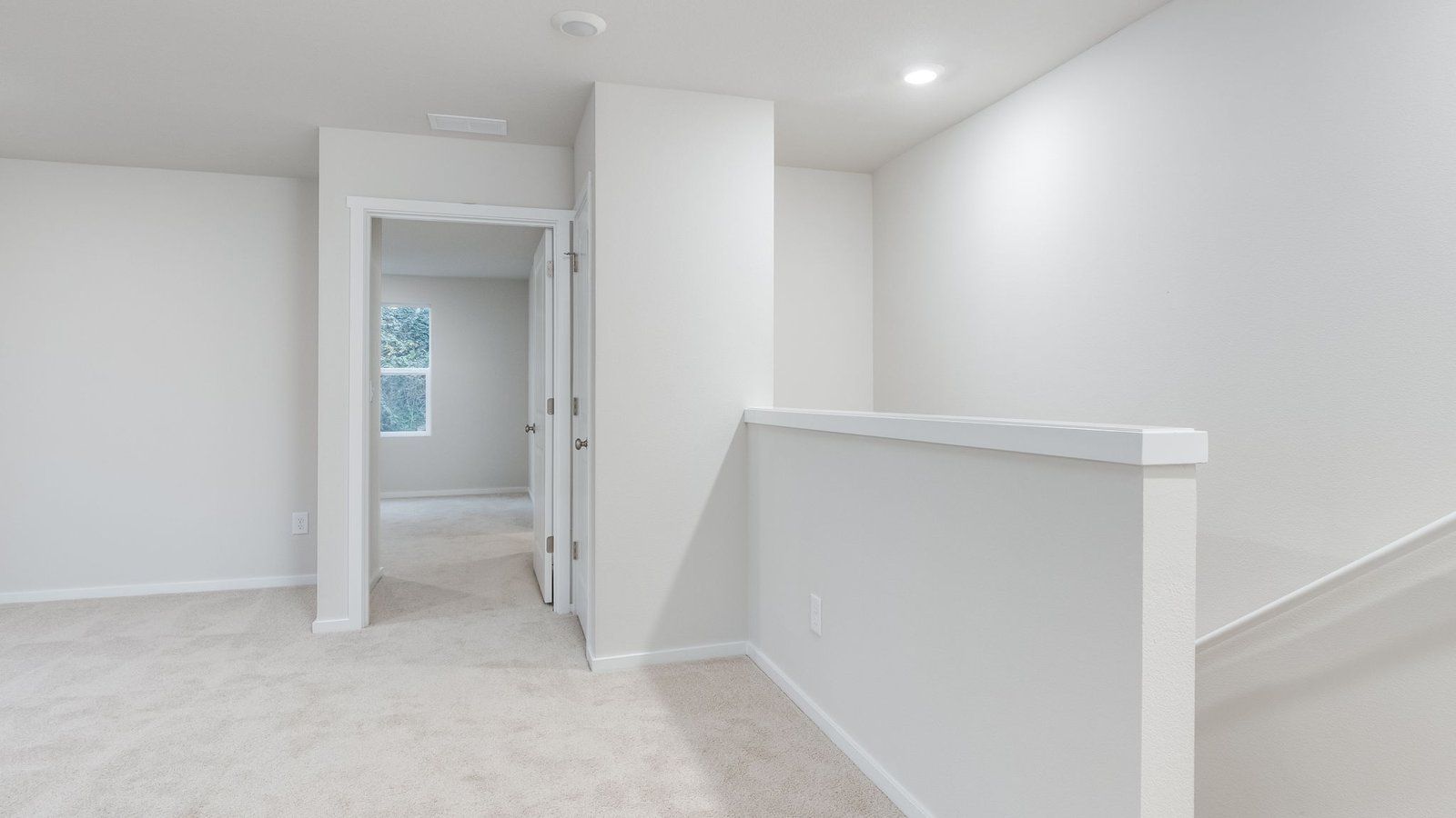 Hallway with wall-to-wall carpet
