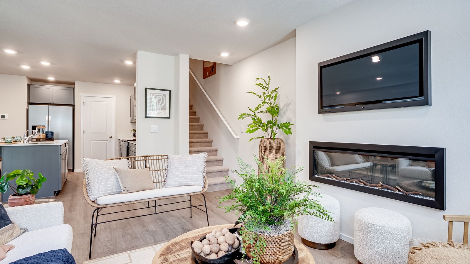 Great room with laminate flooring and an electric fireplace