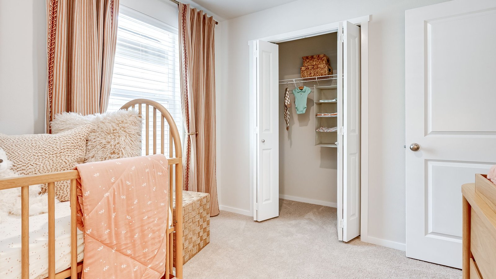Bedroom with wall-to-wall carpet and a closet