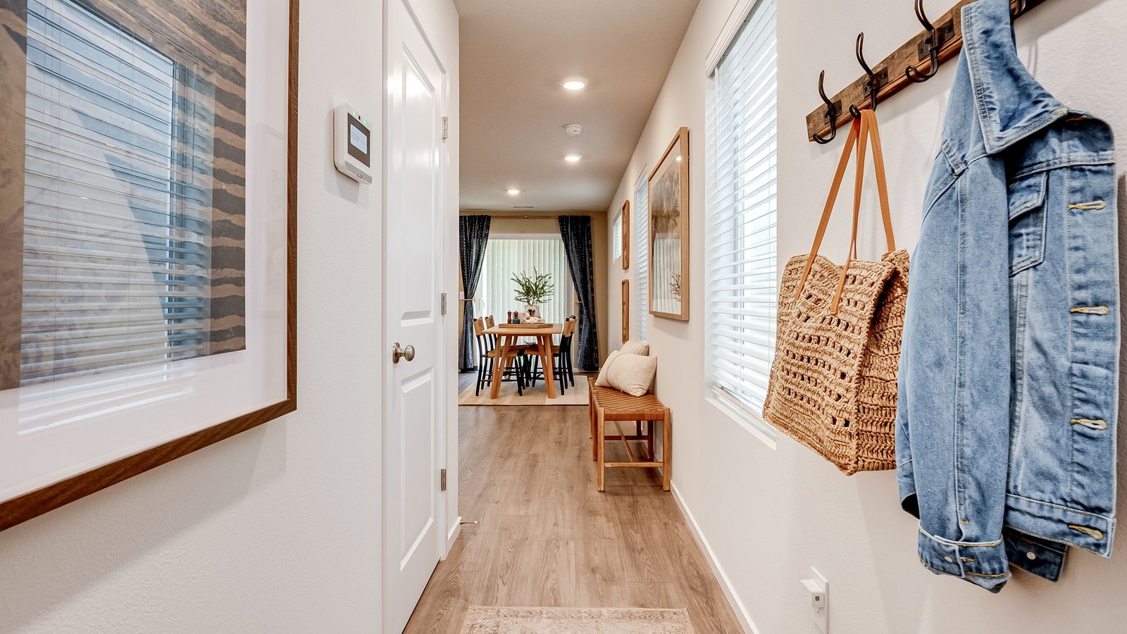 Entryway with a coat closet and laminate flooring