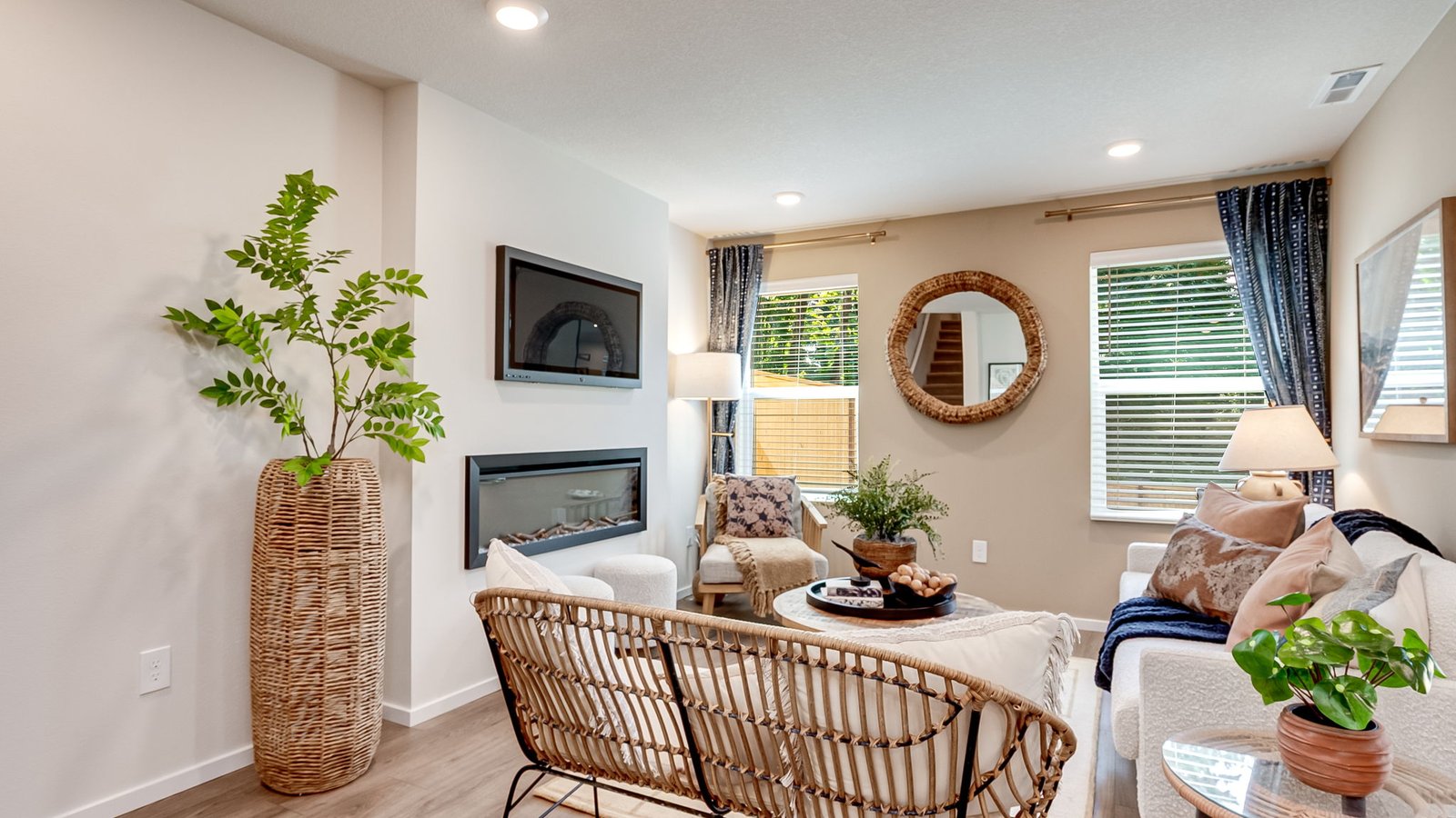 Great room with laminate flooring and an electric fireplace