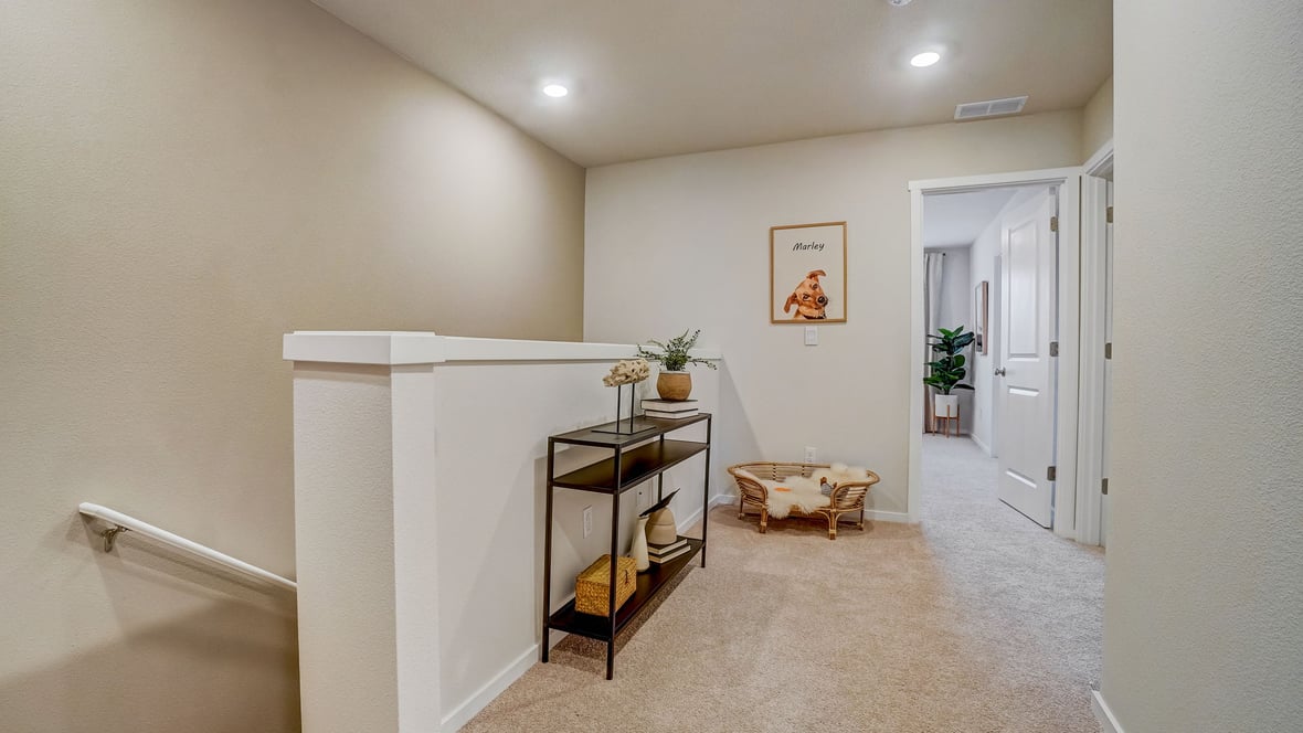 Hallway with wall-to-wall carpet