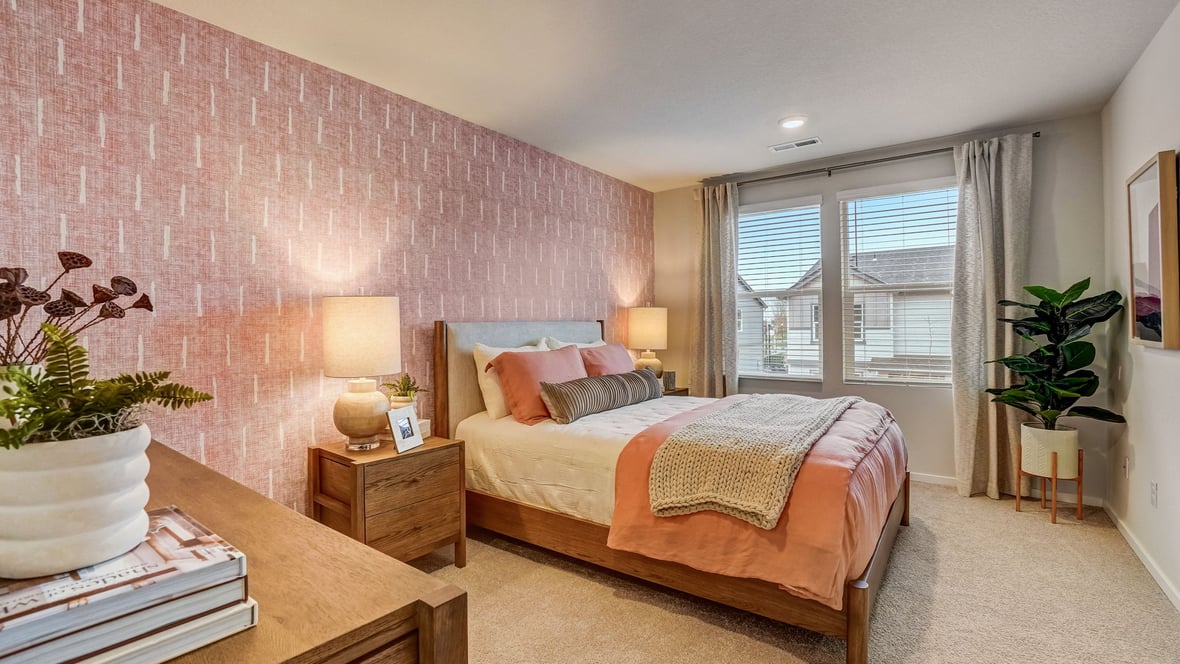 Primary bedroom with wall-to-wall carpet, a walk-in closet and an attached bathroom
