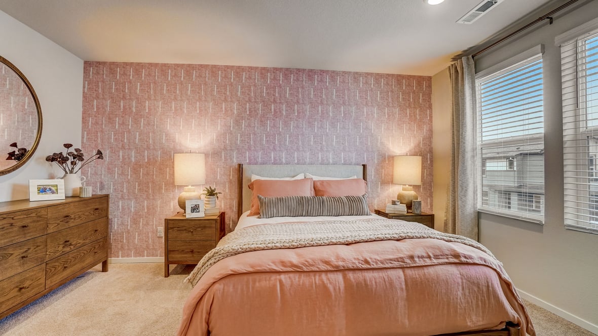 Primary bedroom with wall-to-wall carpet, a walk-in closet and an attached bathroom