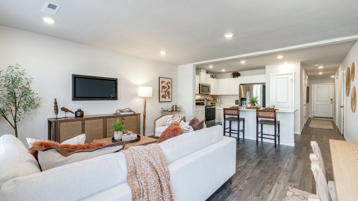 Great room with laminate flooring and an electric fireplace