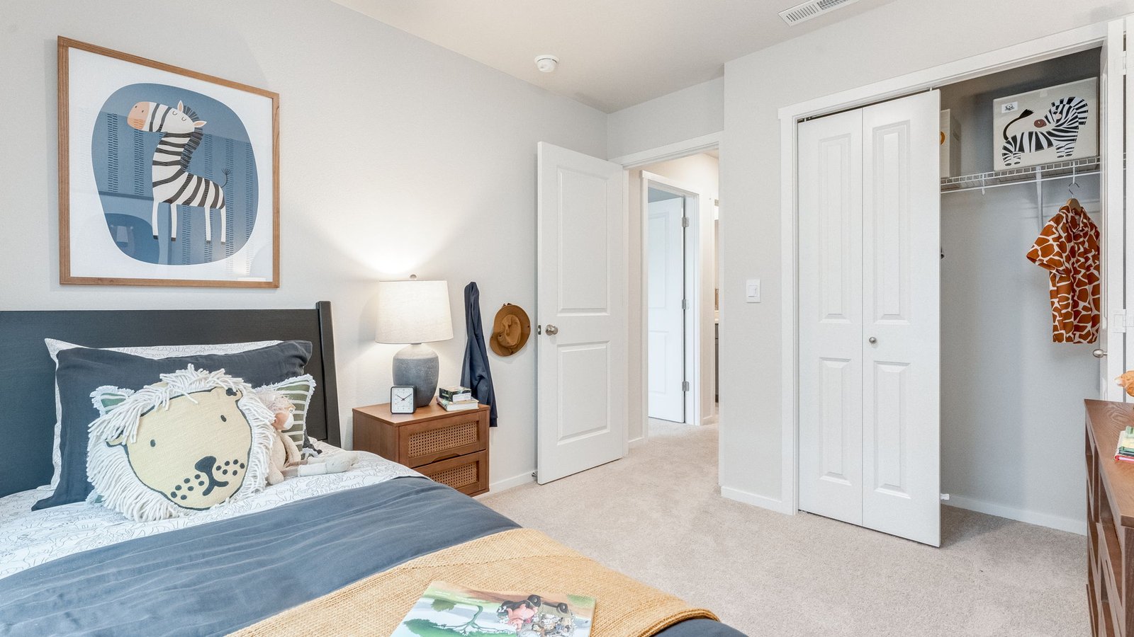 Bedroom with wall-to-wall carpet and a closet