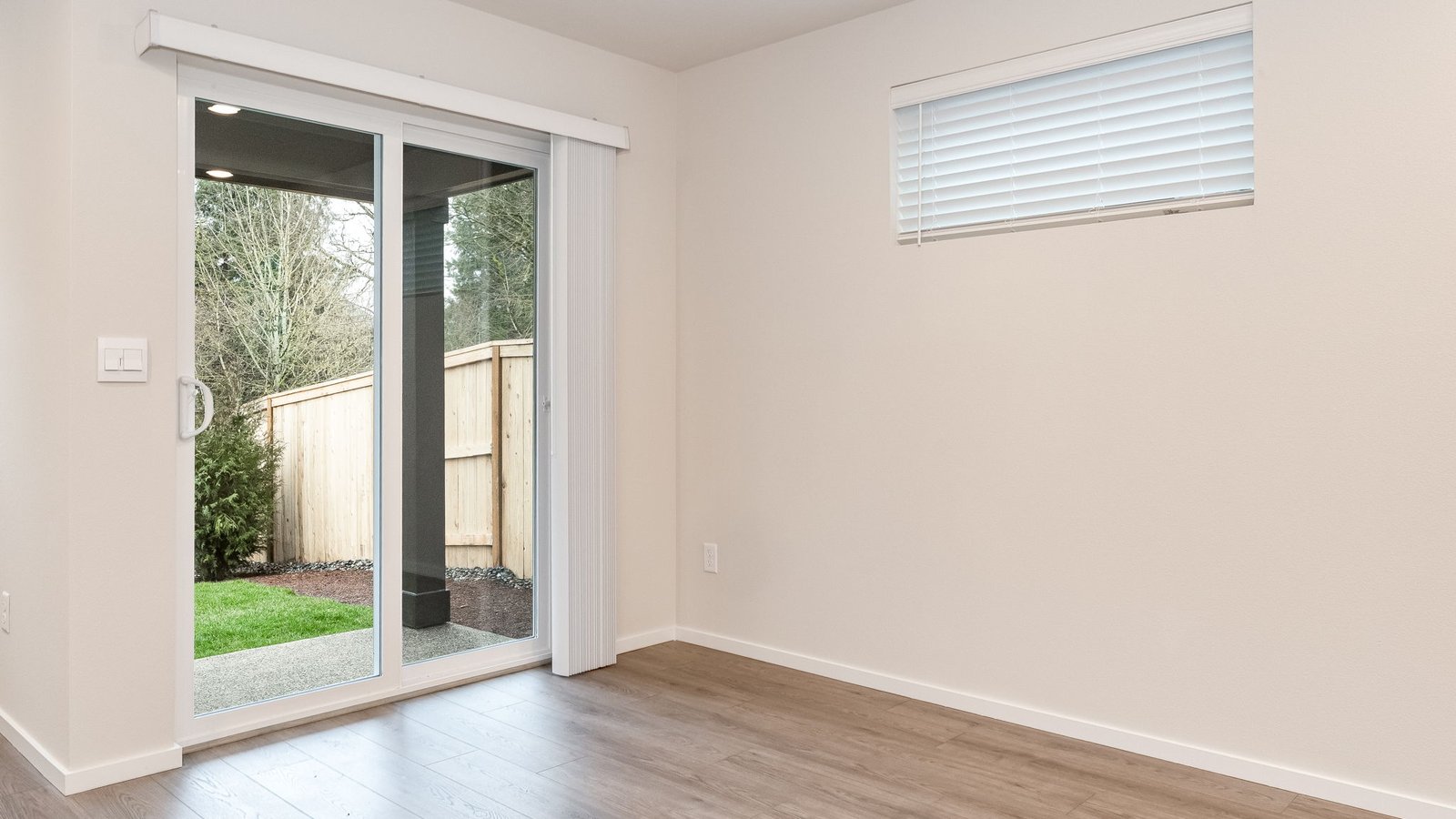 Dining area with a sliding glass door to a fenced backyard