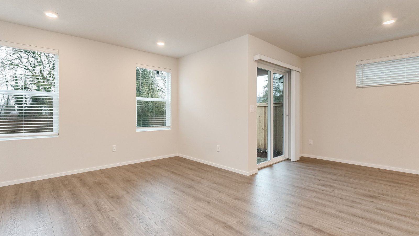 Great room with laminate flooring and an electric fireplace