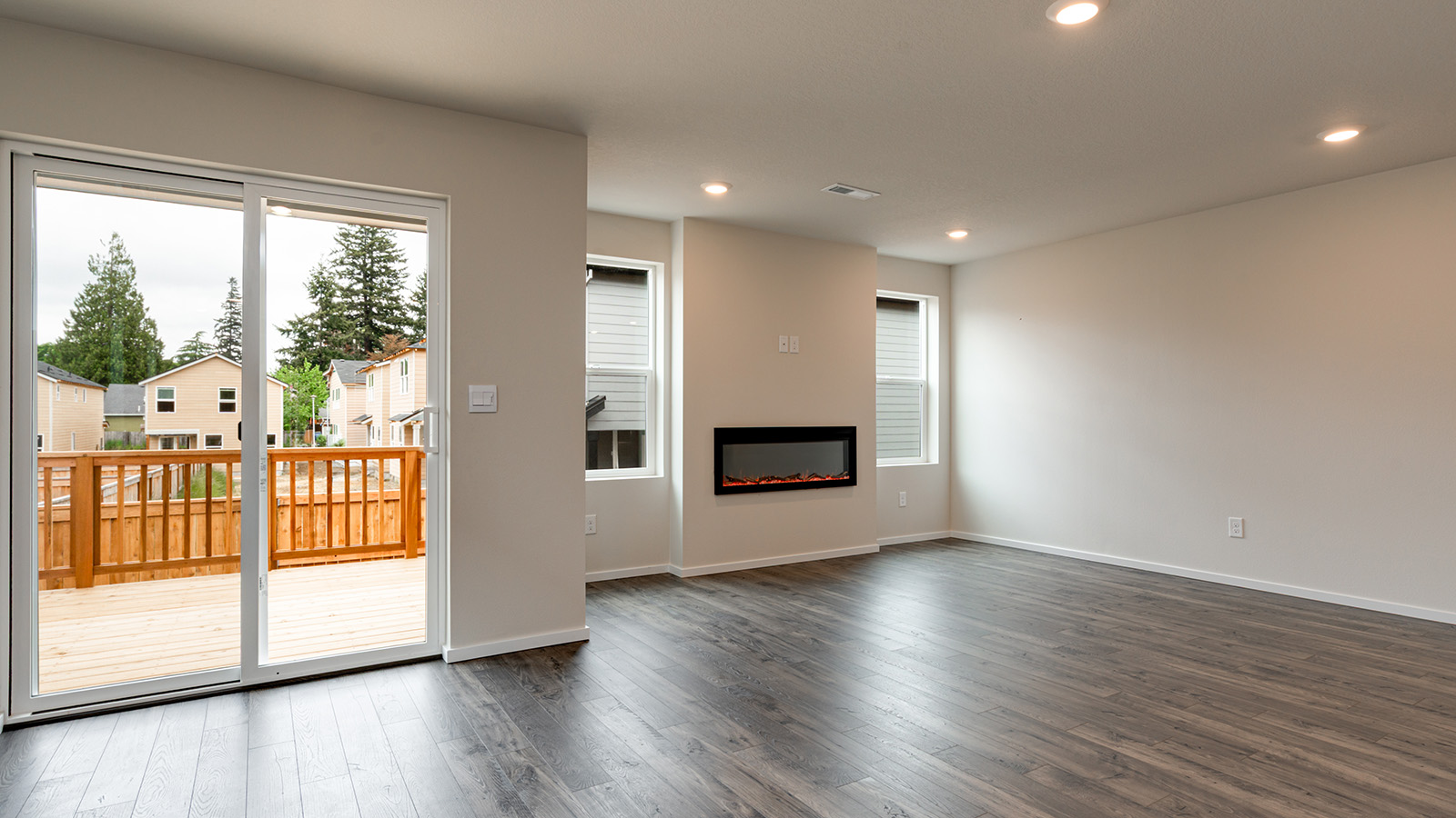 Great room with laminate flooring and an electric fireplace