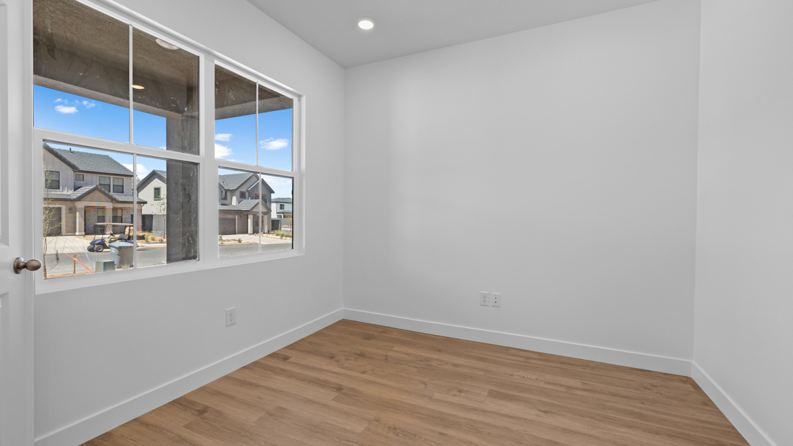 private office with large picture window and premium laminate flooring