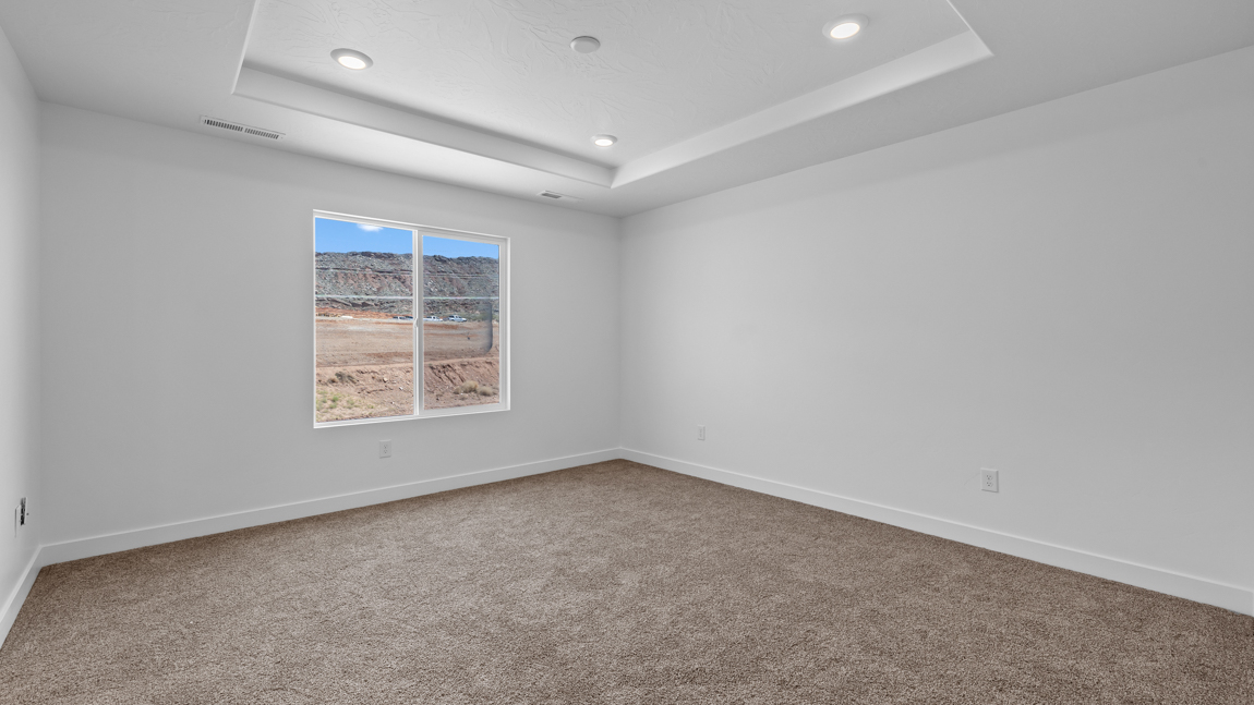 Spacious bedroom with large bright window