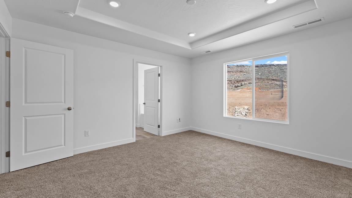 Spacious bedroom with large bright window