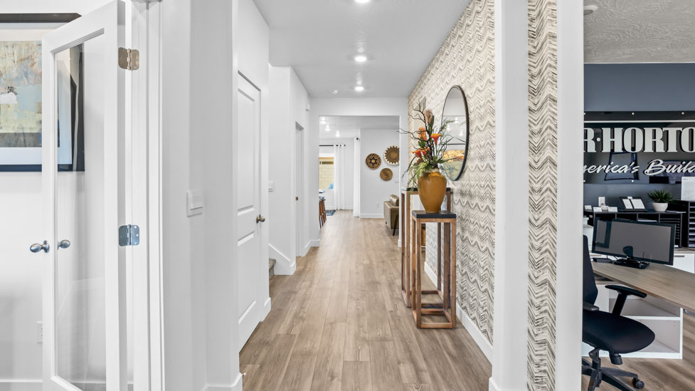 Wide hallway entry opening to the main floor living area