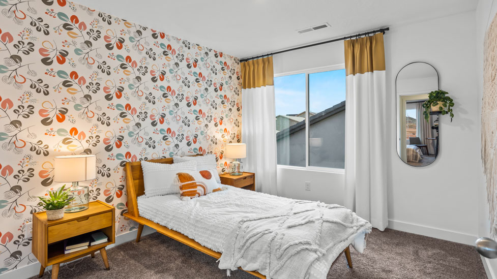 Spacious bedroom with large bright window