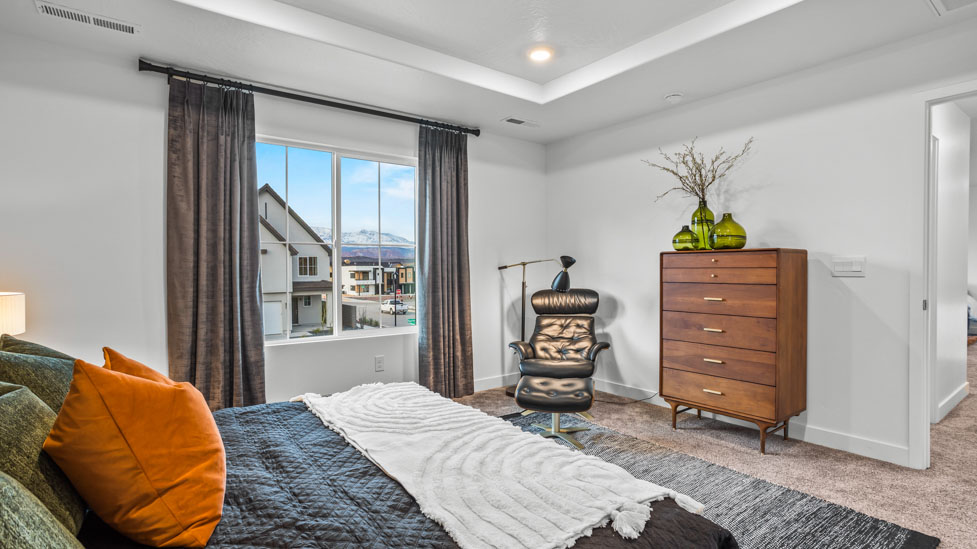 Spacious bedroom with large bright window