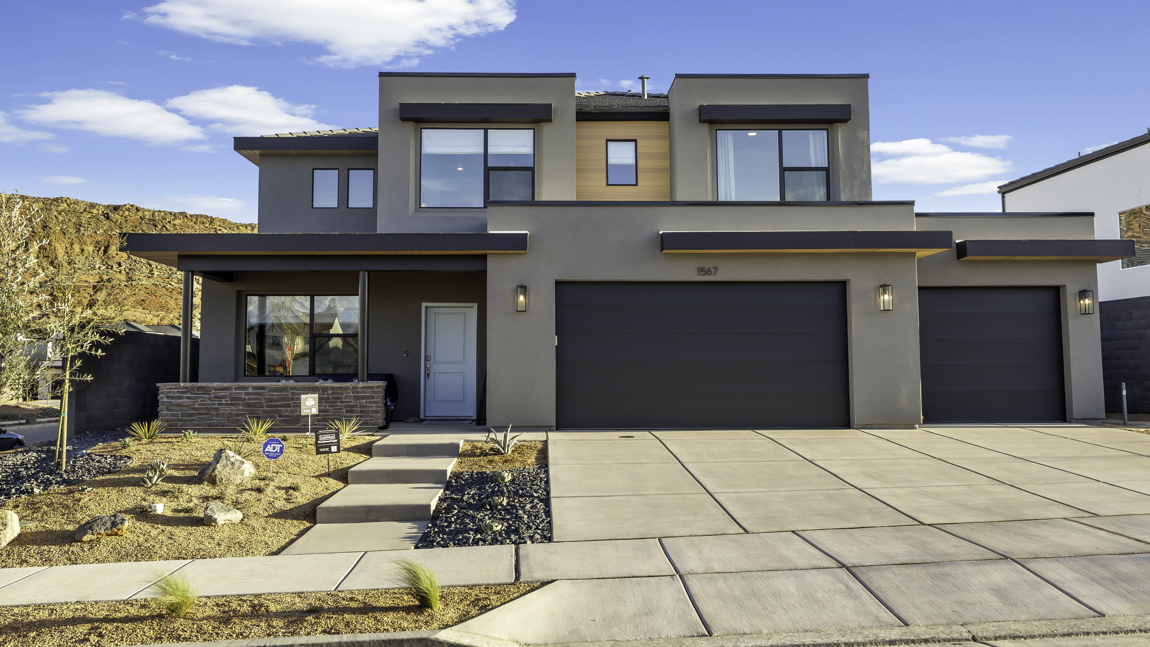 brand new desert style exterior home in Washington with three car garage