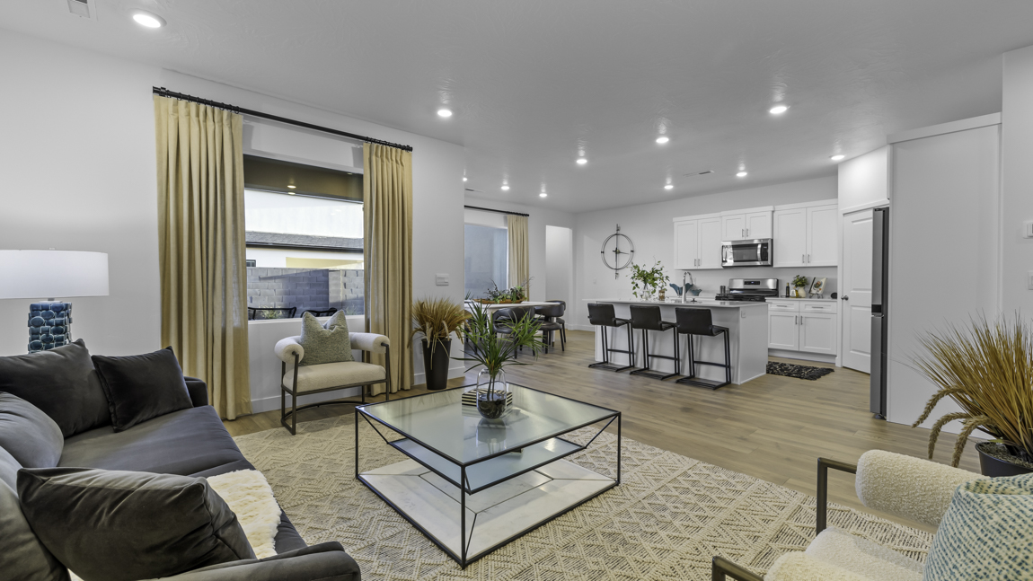 Large living room and adjoining kitchen and dining room with large picture windows