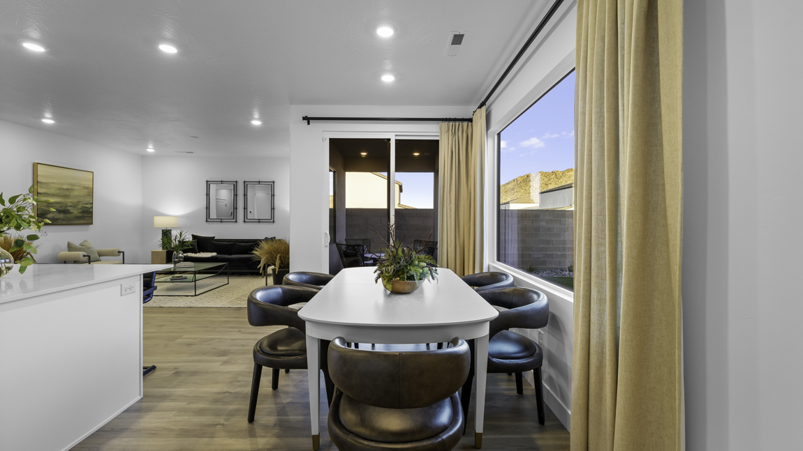 Dining room area with large picture window and premium laminate flooring