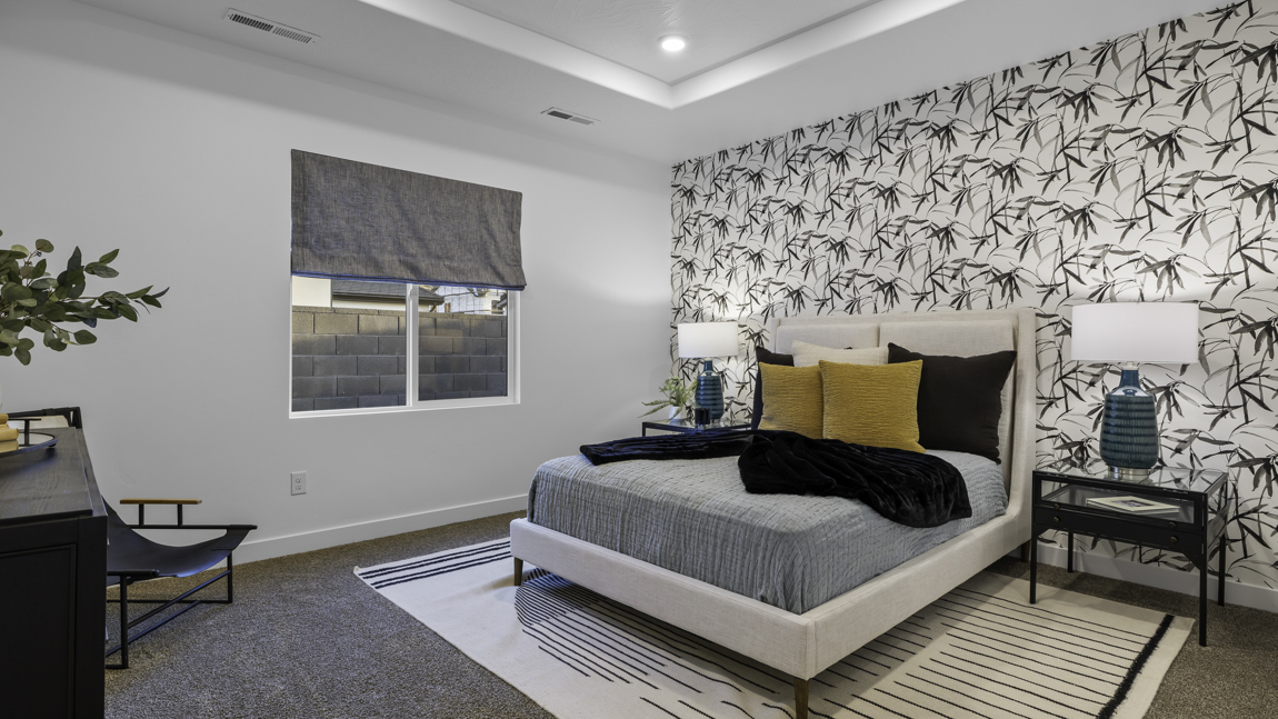 Spacious bedroom with large bright window