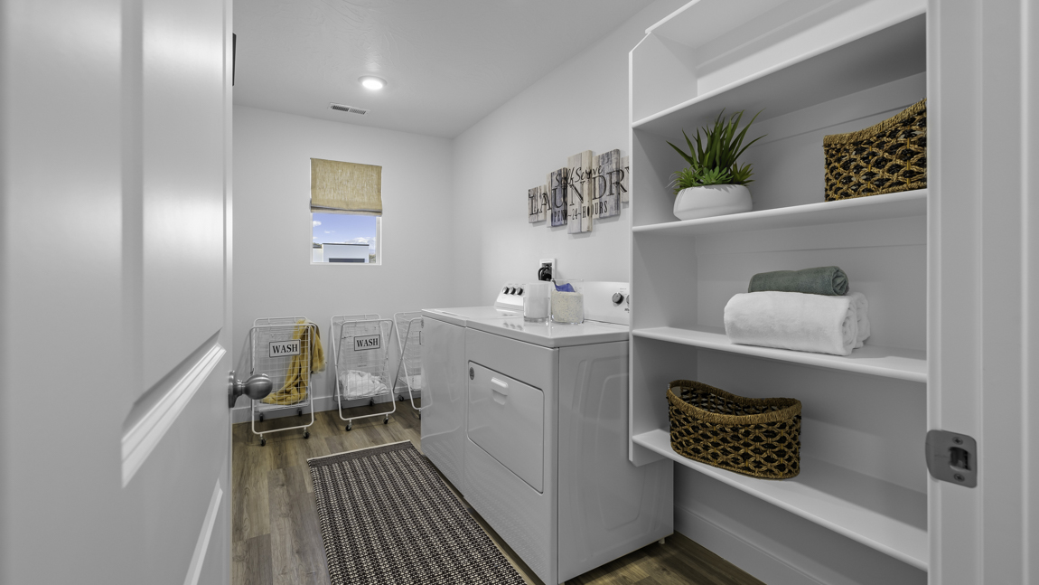 Large laundry room with built in shelving