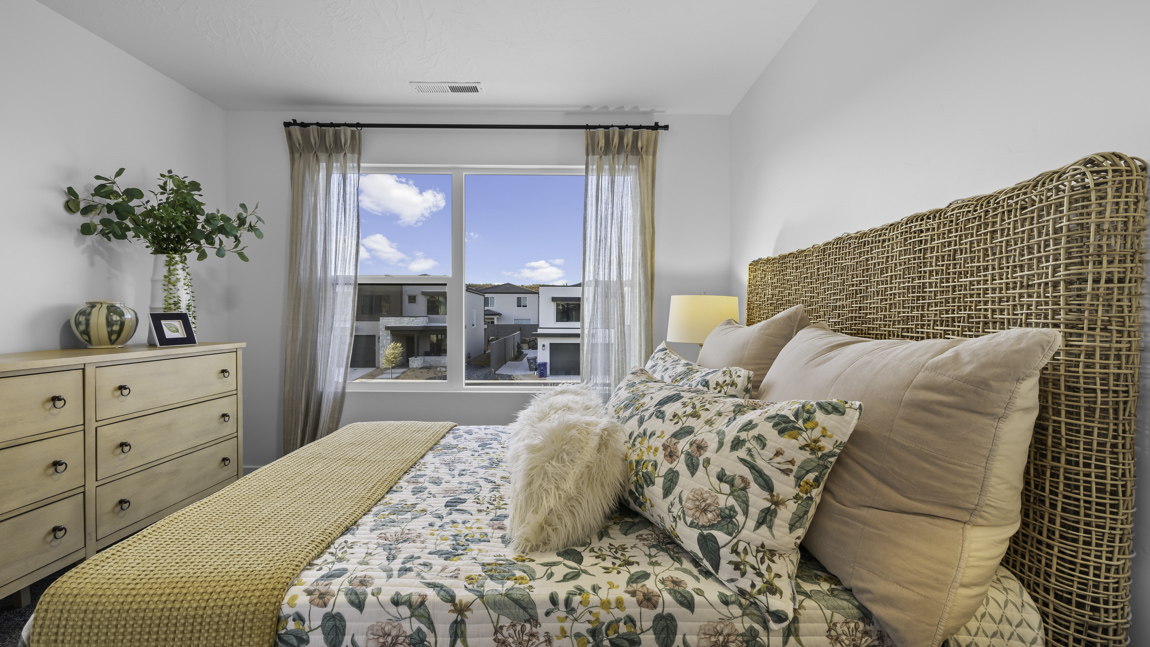 Spacious bedroom with large bright window