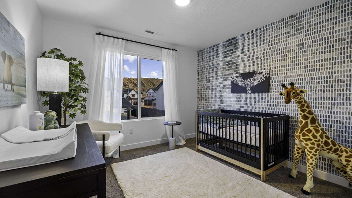 Spacious bedroom with large bright window