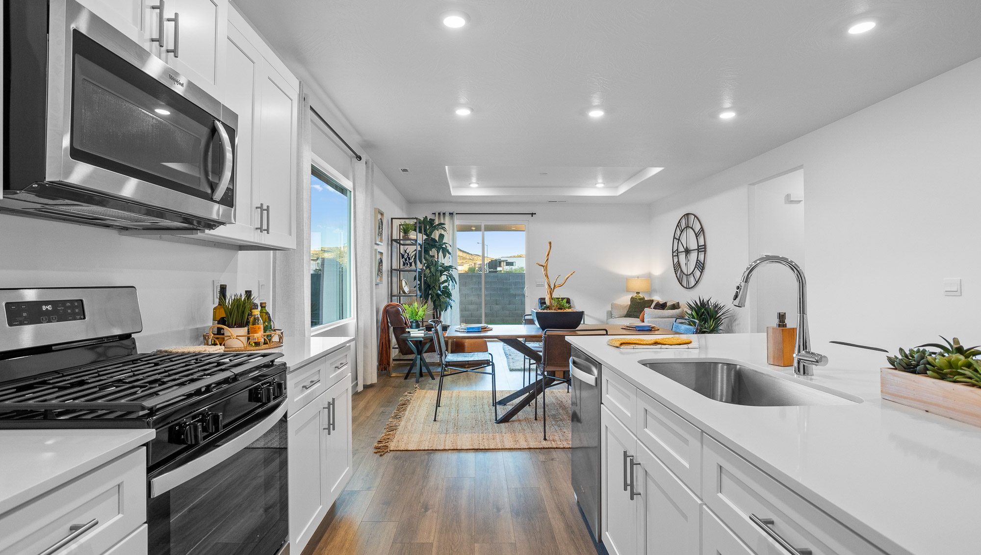 Spacious kitchen with quartz countertops, island, opening to the dining room