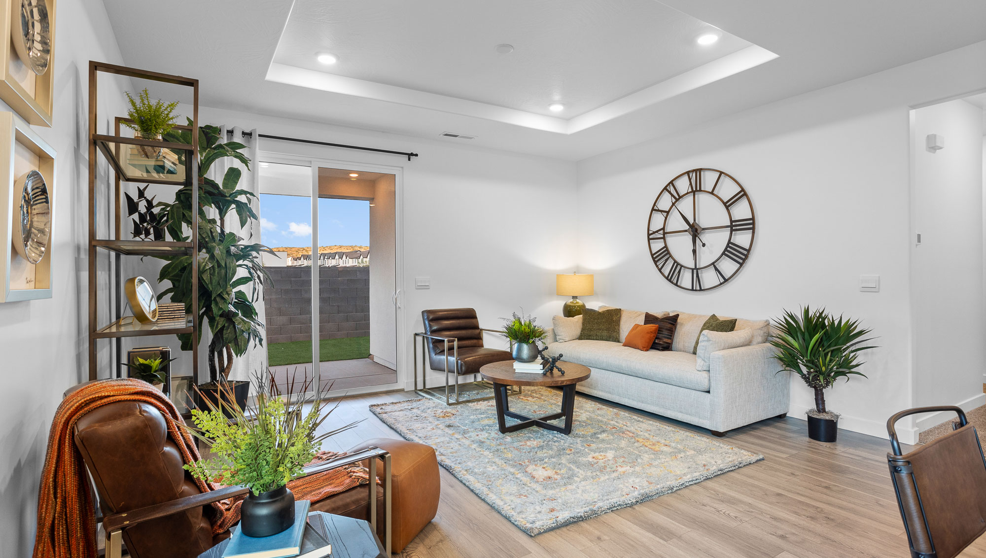 Open family room with a large window and premium laminate flooring
