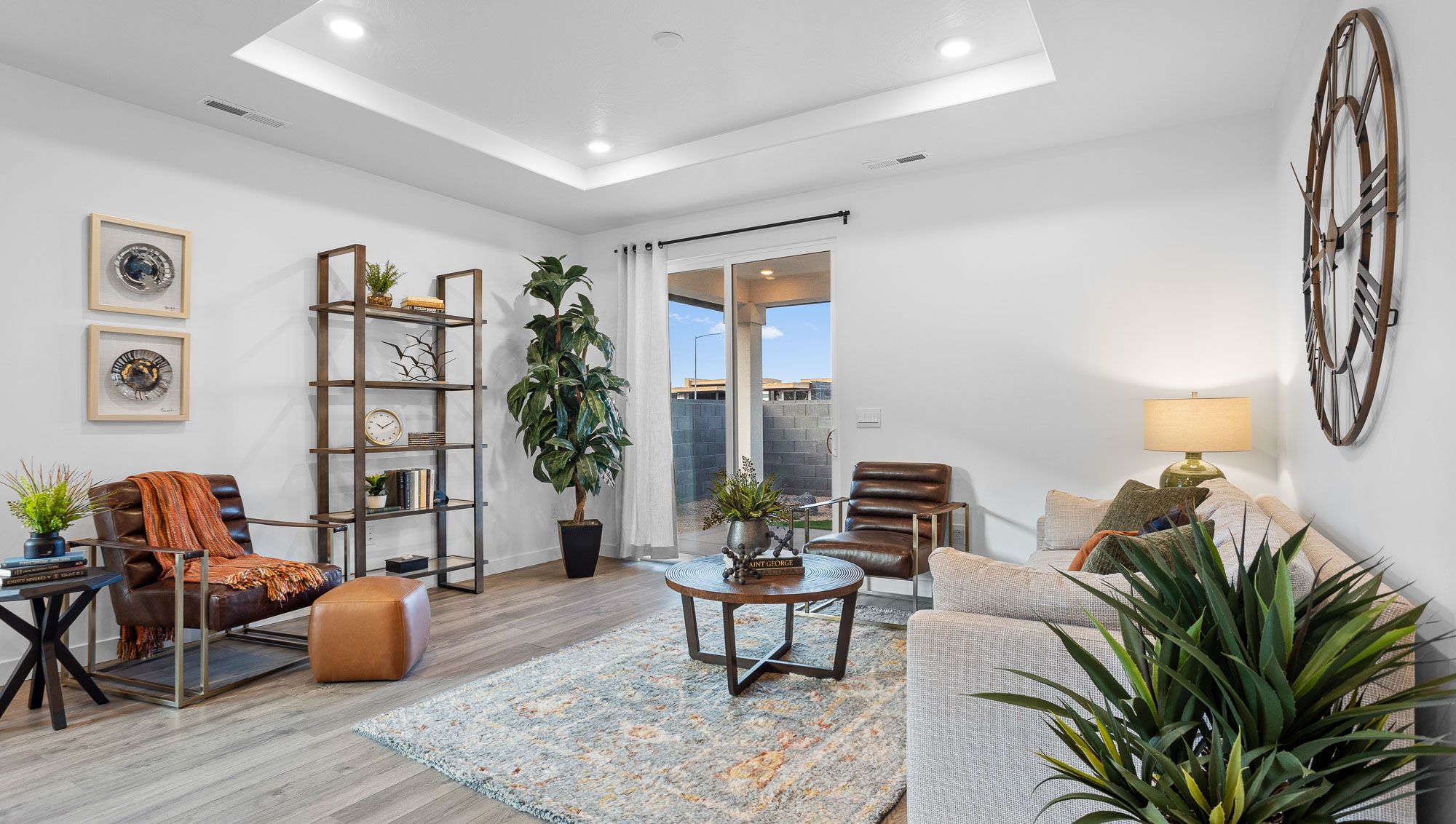 Open family room with a large window and premium laminate flooring