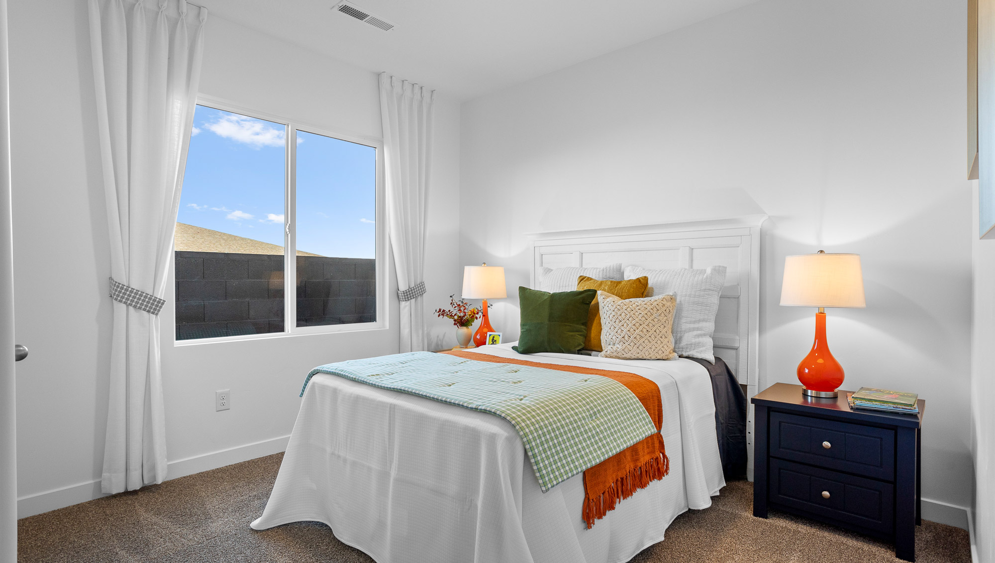 Spacious bedroom with large window