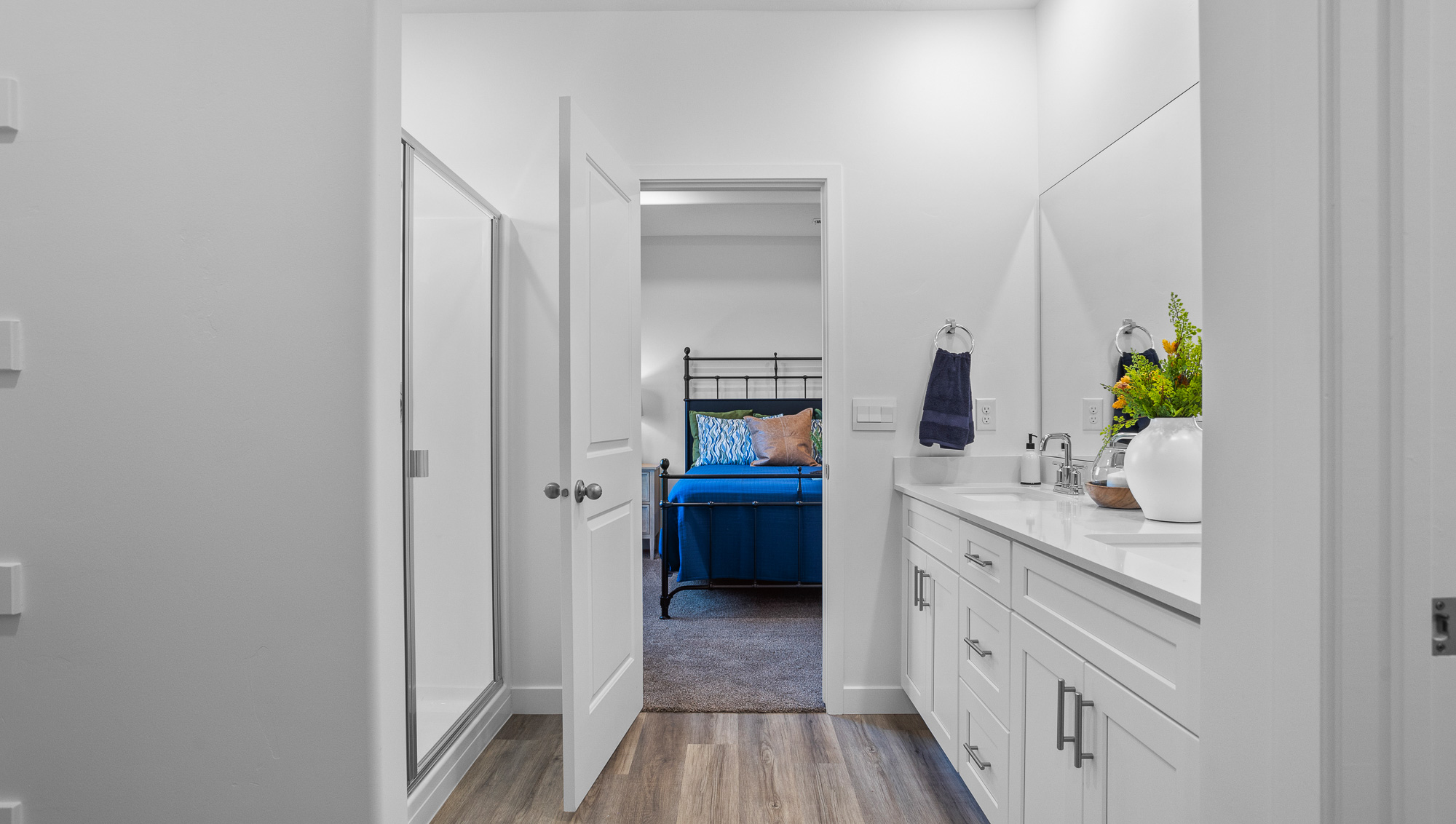 Primary bathroom with dual vanity and walk in shower