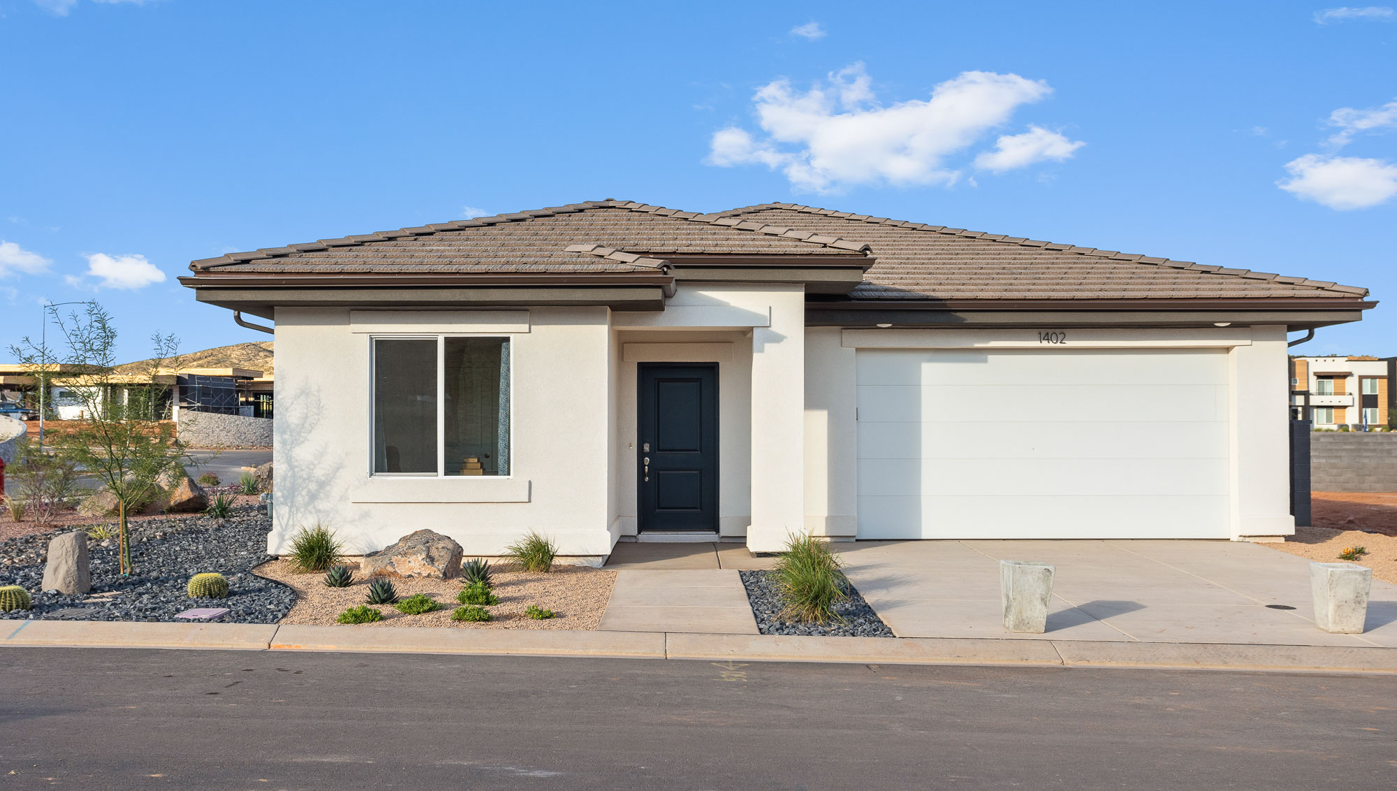 brand new single story home in St George with a desert style exterior and two car garage