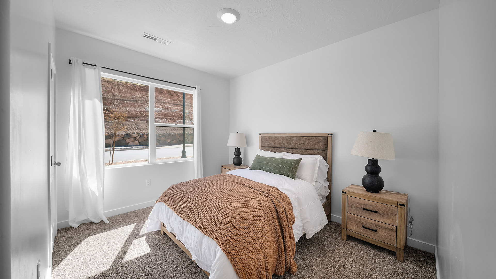 Front bedroom with large window.