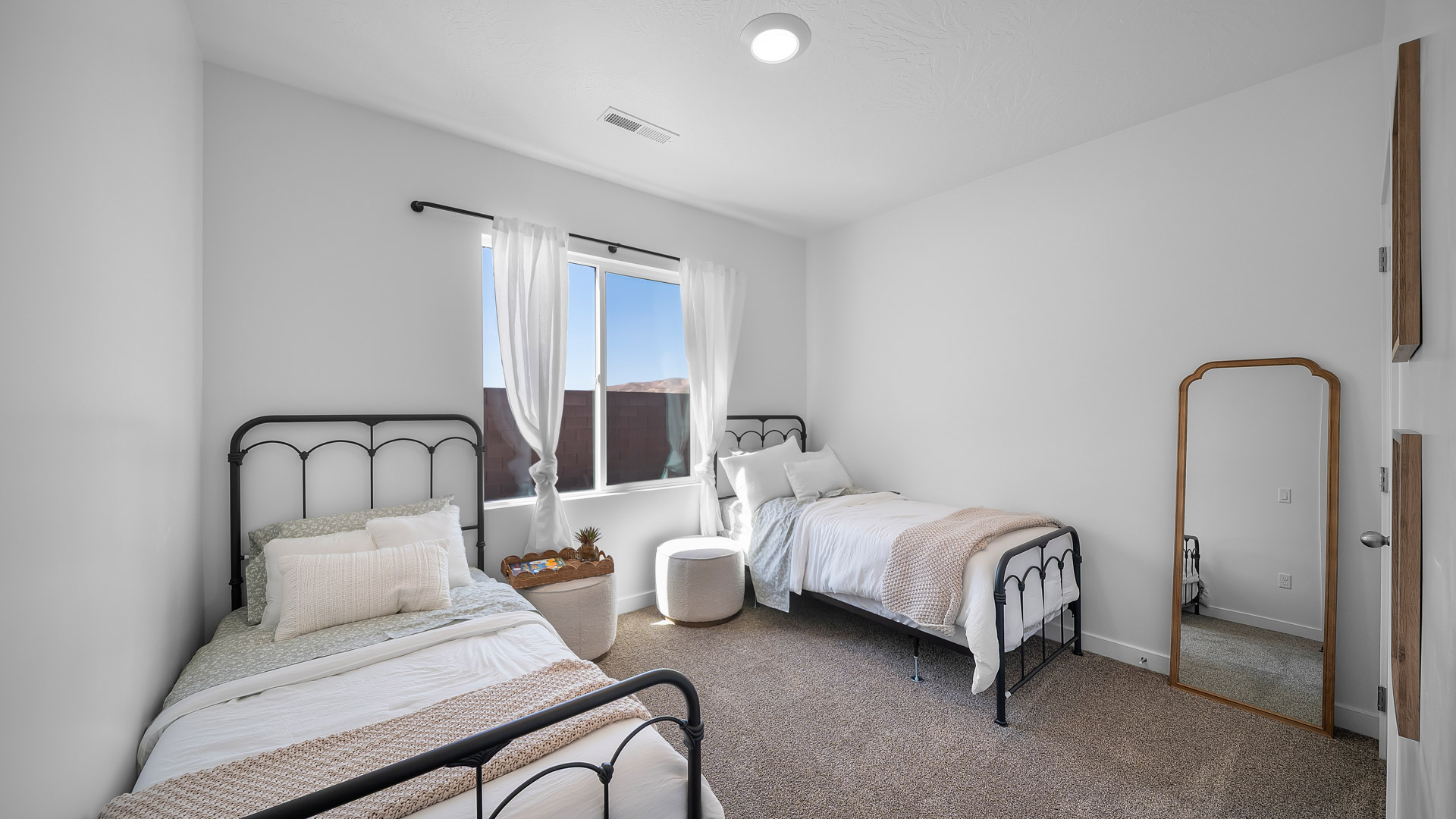 Bedroom with large window.