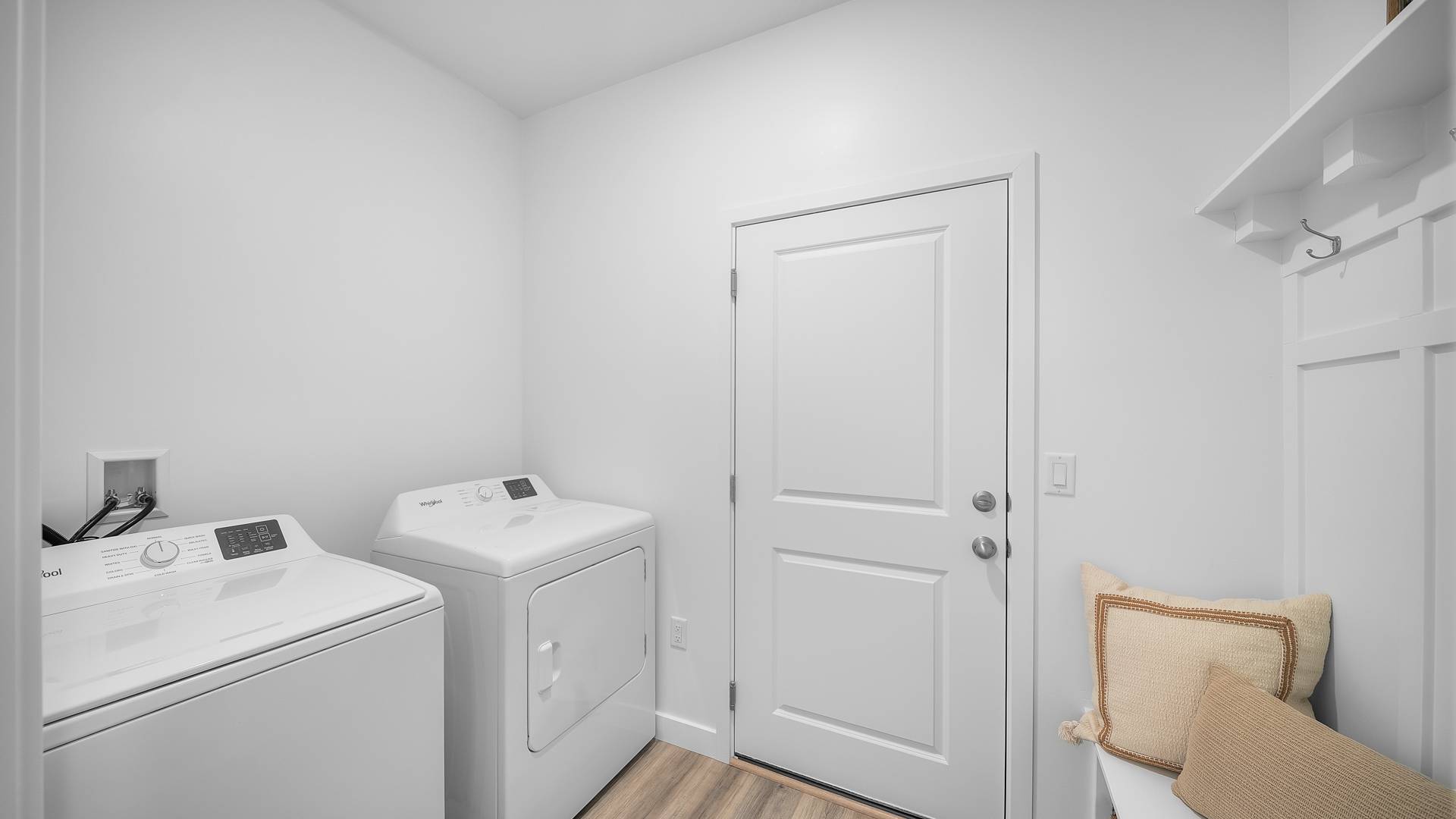 Laundry and mudroom with bench.