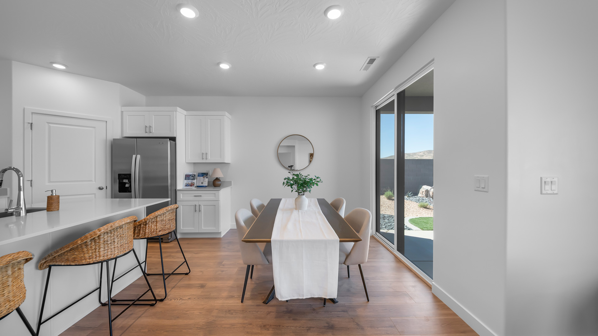 Dining area off kitchen with glass patio doors.