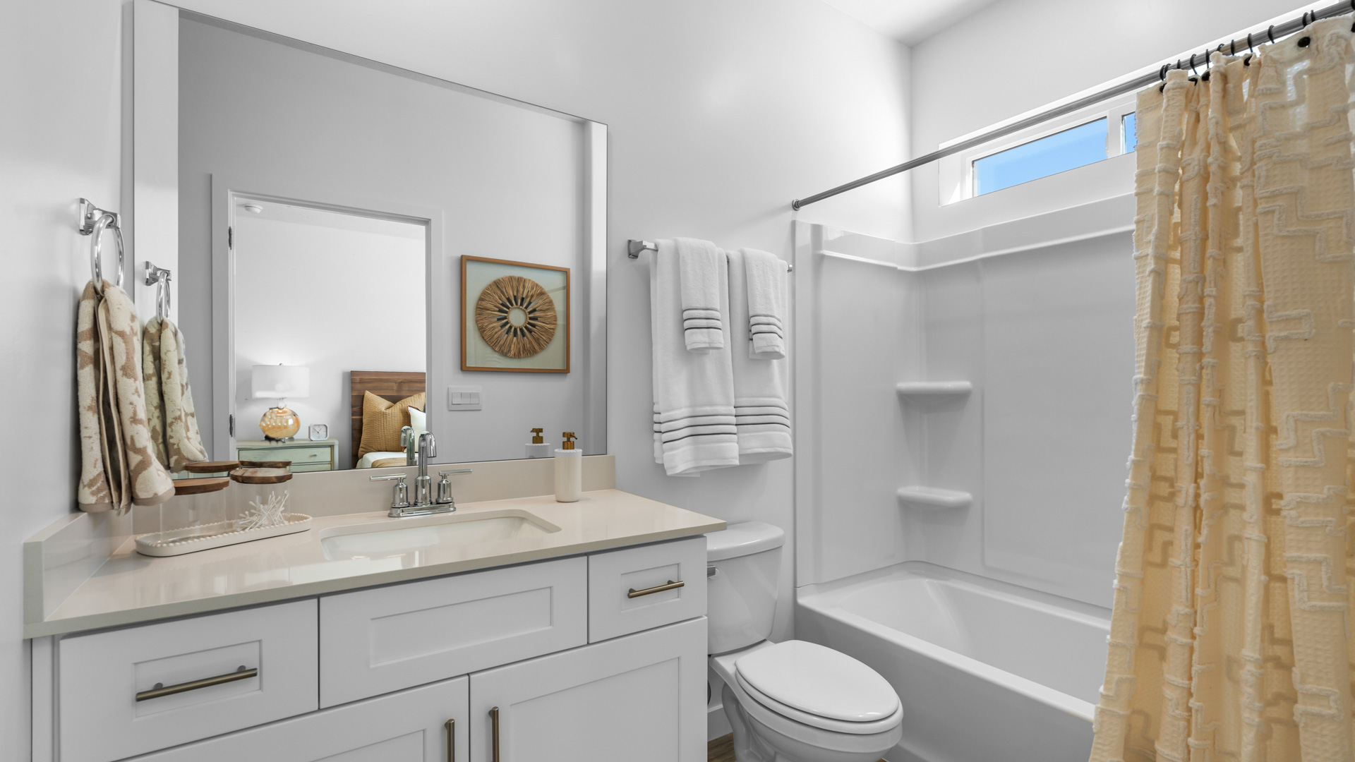 Casita bathroom with shower surround and window.