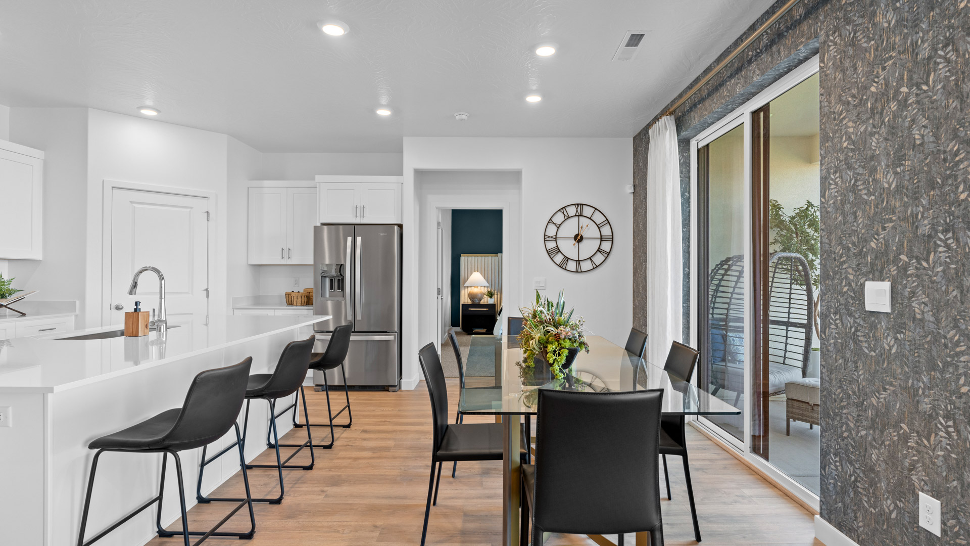 Dining space in kitchen with large patio doors.