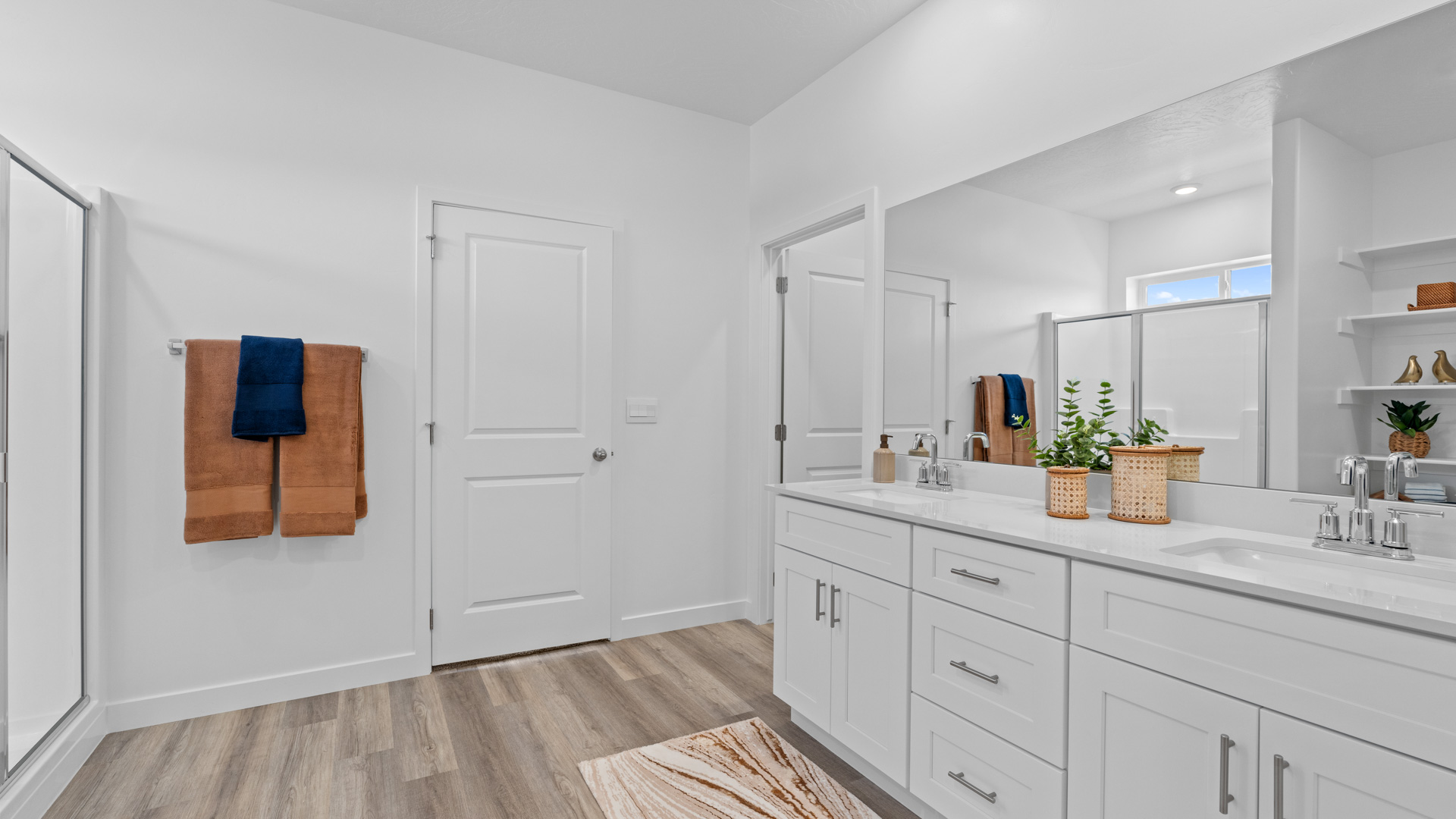 Spacious main bathroom with double sink vanity.