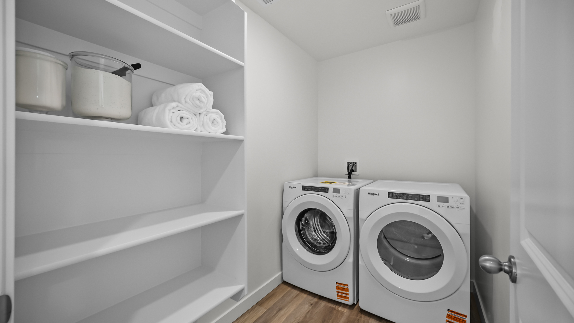 Laundry room with build-in shelving for storage