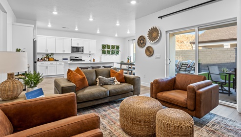 A beautiful view of the entire open concept of the main floor of the living room, kitchen and dining area of the Stillwater model home in the D.R. Horton Long Valley community.