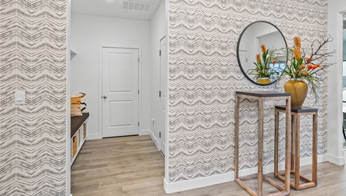 From the entryway viewing towards the mudroom with built in organization.